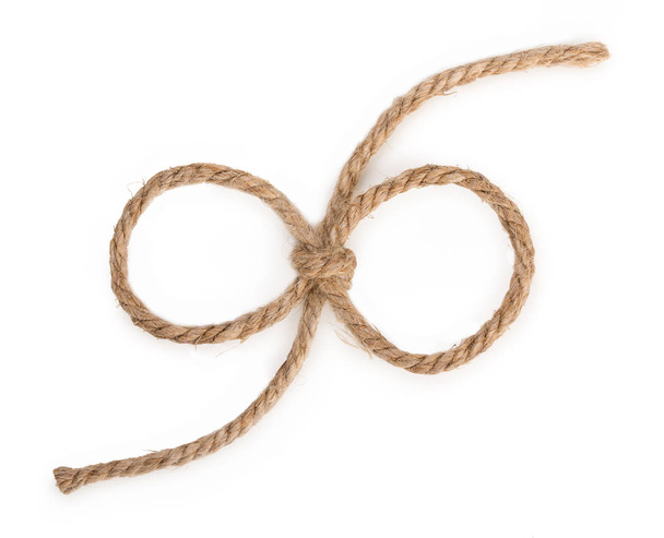 Rough rope bow knot, isolated on white background, close up, top - 写真・画像