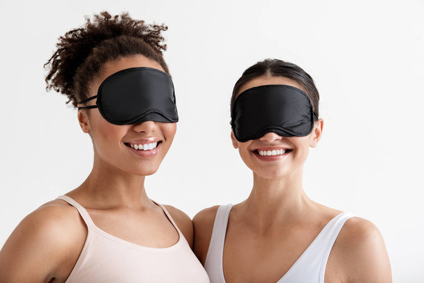 Content ladies wearing sleeping masks - Фото, зображення