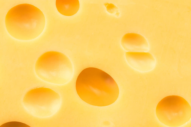  Texture of the cheese. Pattern of cheese with large holes - Foto, Imagen