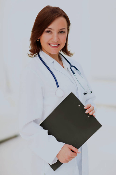 Medical physician doctor woman over blue clinic background. - Фото, зображення