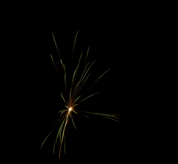 Brightly colorful fireworks in the night sky - Фото, зображення