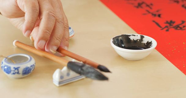 Dipping black ink for writing Chinese calligraphy  - Photo, Image