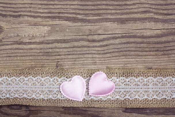 Rustic wooden background with sacking border and hearts. Copy sp - Photo, Image