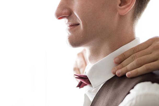 stylish groomsman helping happy groom getting ready in the morning for wedding ceremony. - Photo, image