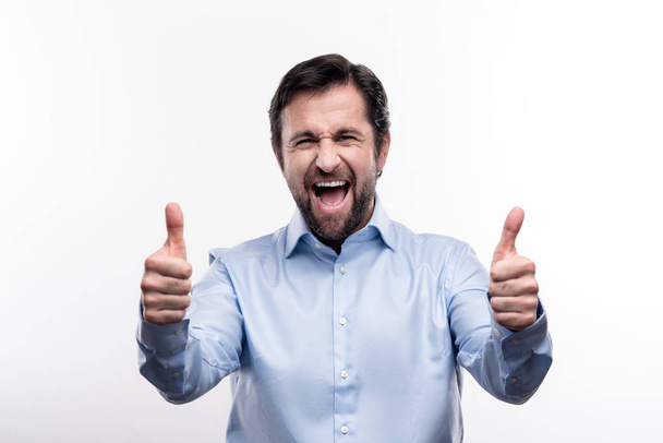 Happy middle-aged man showing thumbs up - Fotoğraf, Görsel