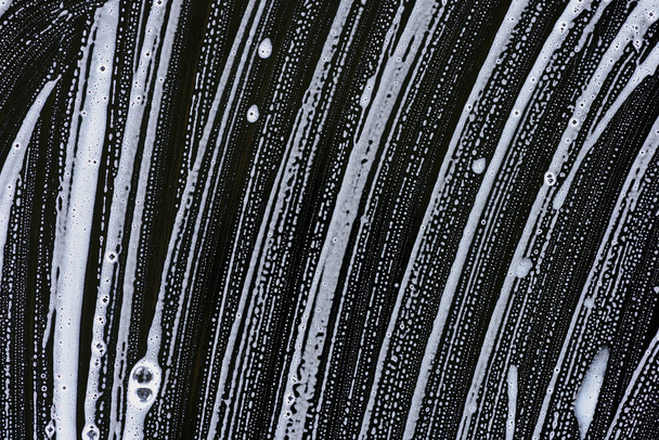 mousse de savon blanche sur surface noire
 - Photo, image