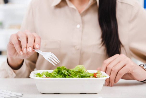 partial view of businesswoman with take away food at workplace in office - Photo, Image