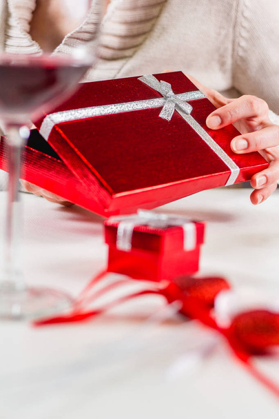 close-up of woman opening red gift box - Photo, Image