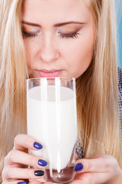 Woman drinking milk from glass - 写真・画像