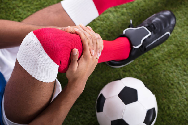 Close-up Of An Injured Male Soccer Player On Field - Foto, imagen