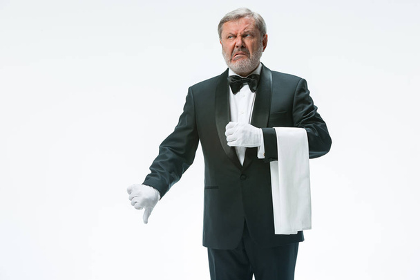 Senior waiter holding white towel - Photo, image