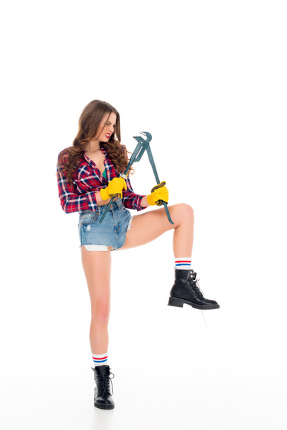 beautiful sexy girl posing with adjustable wrench, isolated on white - Fotoğraf, Görsel