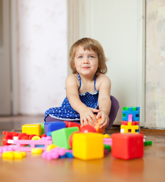 girl plays with toys in home - Foto, imagen