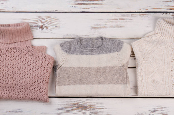 Folded hand knitted sweaters - Φωτογραφία, εικόνα
