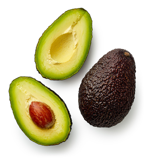 Whole and cut in half avocado - Photo, Image