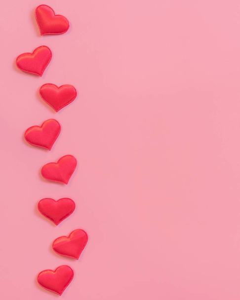 Red heart on pink pastel color background with space for text. - Foto, imagen