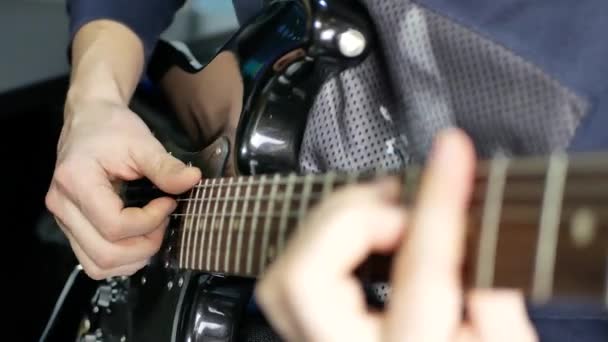 Man lead guitarist playing electrical guitar - Footage, Video