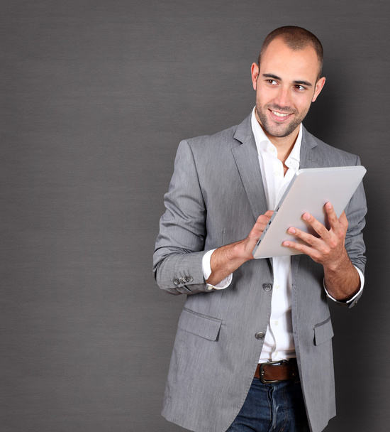 Cool businessman using touchpad - Φωτογραφία, εικόνα