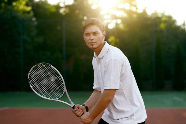 Sports. Male Player Playing Tennis Outdoors. - Zdjęcie, obraz