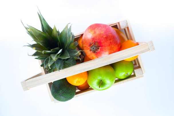 tropical fruits in wooden box - Fotó, kép