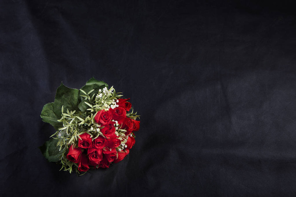 Bouquet of roses on the black scene. - Фото, зображення