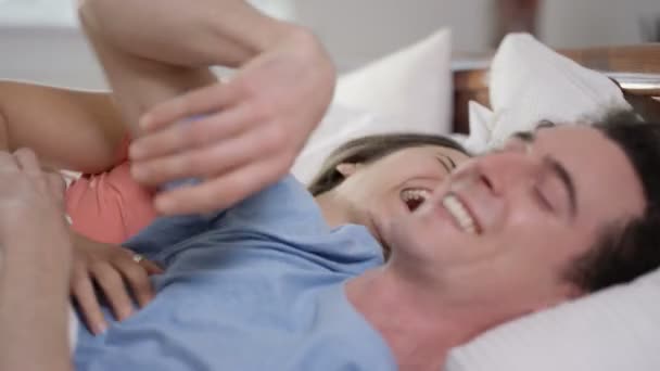 4K Happy couple enjoying early morning affections in the bedroom - Felvétel, videó