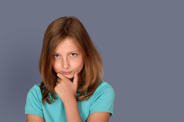 Portrait of young girl with upset look - 写真・画像