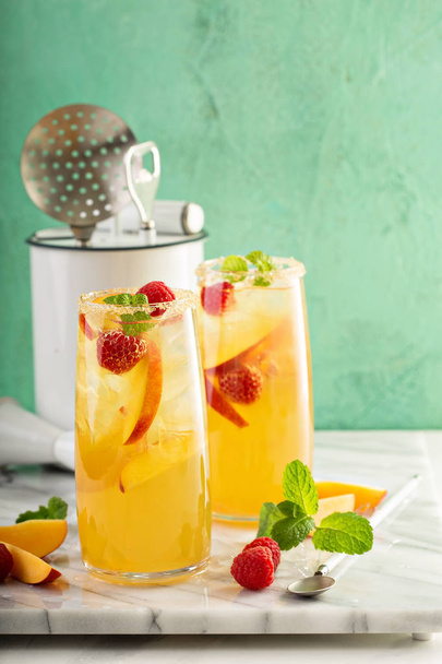 Colorful refreshing cold summer drink with peaches - Photo, image