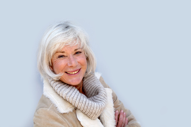 Portrait of smiling senior woman - Foto, imagen