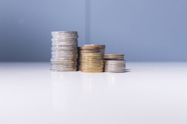 Close up of coins stacks on a table,Saving money concept - Φωτογραφία, εικόνα