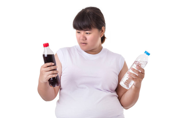 Fat Asian woman wearing white t-shirt and choosing soft drink or - Φωτογραφία, εικόνα