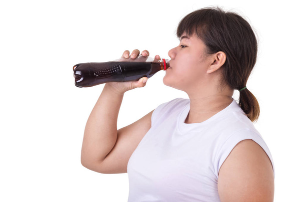 Fat Asian woman wearing white t-shirt and drinking soft drink or - Foto, afbeelding