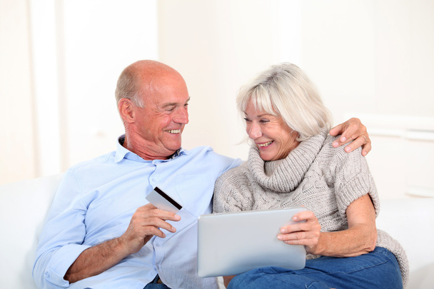 Senior couple doing online shopping - Фото, зображення