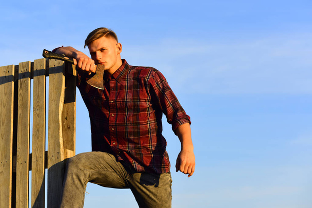 lumberjack guy with ax on blue sky background, camping. - Zdjęcie, obraz