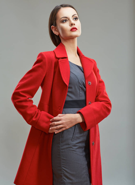 businesswoman dressed in red coat. - Foto, afbeelding