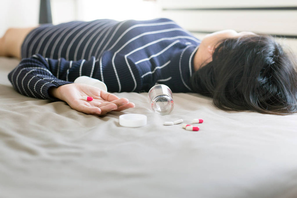 Woman sleep unconscious after eaten pills,Drug overdose concept - Фото, зображення