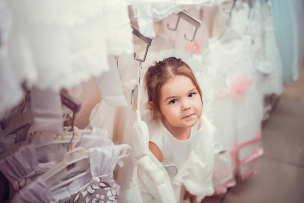 Little girl and new clothes - Fotó, kép