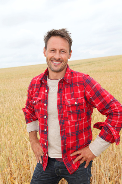 Portrait of smiling man in countryside - Zdjęcie, obraz