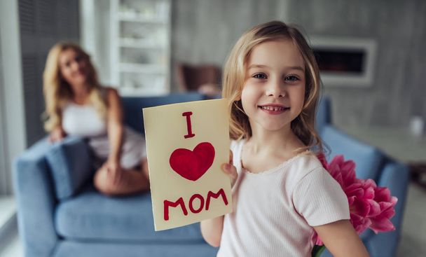 Mom and daughter at home - Фото, изображение