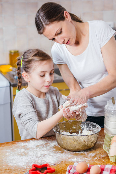Mother and daughter making dough - Photo, Image