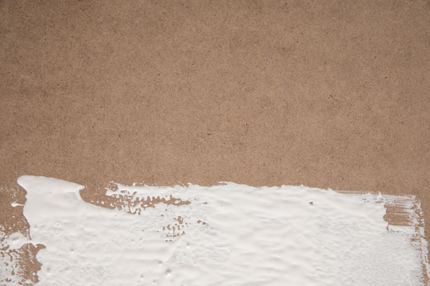 white paint on brown plywood surface - Φωτογραφία, εικόνα