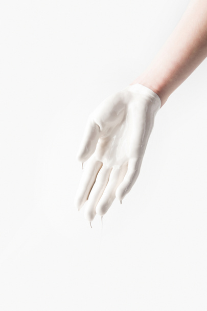 cropped image of woman in white paint in shape of glove isolated on white - Photo, Image