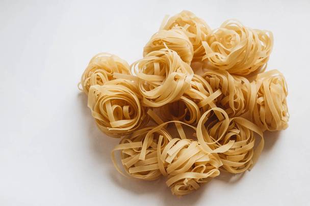 pile of uncooked noodles on white background     - Photo, Image