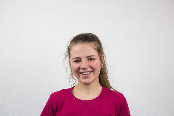 Teenager with a smile, white background, facial expressions, happiness, joy - Zdjęcie, obraz