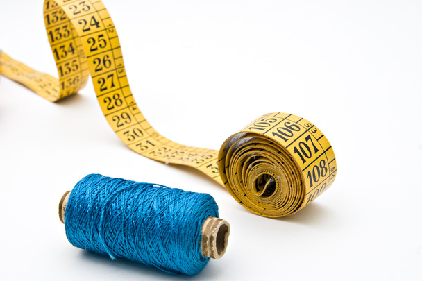 Measure tape and blue thread bobbin - Photo, Image