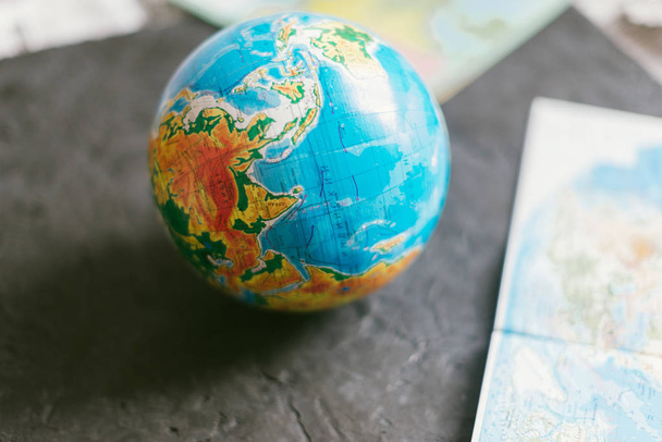 Globe on a blurred background on the map. - Fotografie, Obrázek