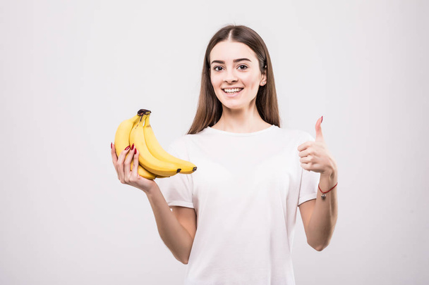 beautiful young woman with bananas isolated on white - Zdjęcie, obraz