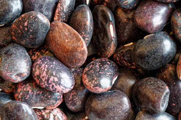Dried kidney brown speckled beans The concept of proper nutrition and healthy lifestyle. Top view, close-up as background or texture - Foto, Imagem
