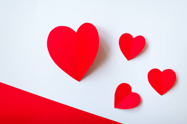 Valentine day background with red hearts, top view. White background with copy space.  - 写真・画像