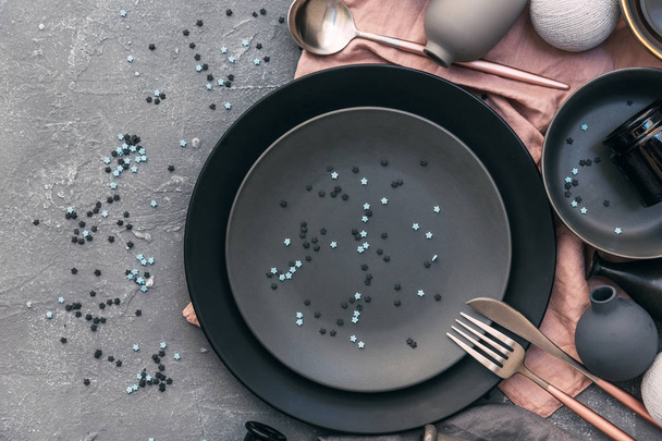 Set of grey crockery on table. Nordic style. Various plates, dish, bowls and mugs. - Foto, Imagem
